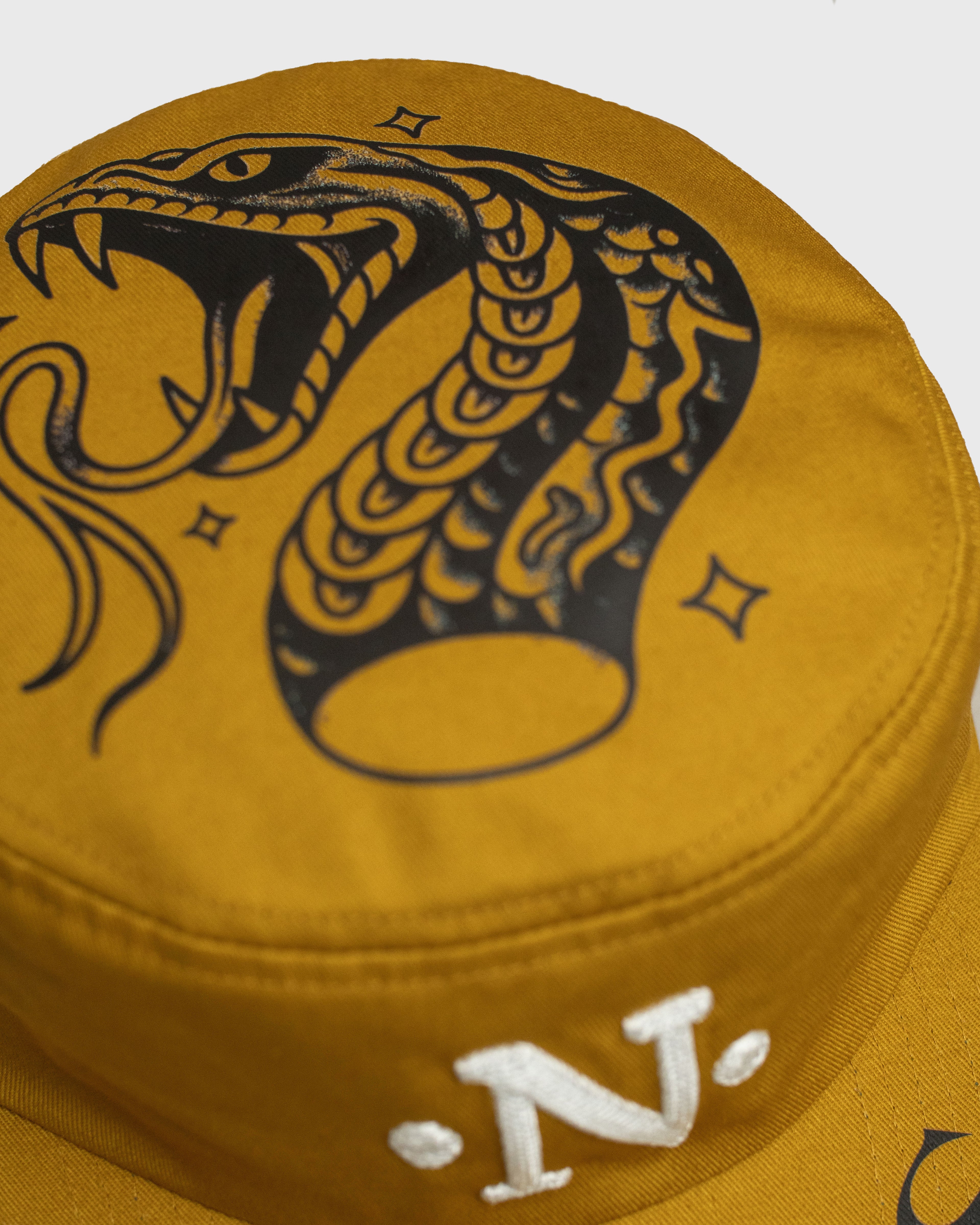 Cap "Altra Epoca" Serpe Ambra